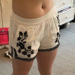 flowy white shorts with blue detailing!